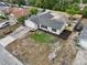 An aerial view of a single Gathering home with newly installed lawn and landscape at 2486 Shiprock Ct, Deltona, FL 32738