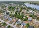 Aerial view of a residential area near a lake, highlighting the community layout and natural surroundings at 2486 Shiprock Ct, Deltona, FL 32738