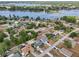 Gorgeous aerial view of a lakeside community with tree-lined streets and well-kept homes at 2486 Shiprock Ct, Deltona, FL 32738