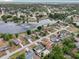 A beautiful aerial view of a neighborhood by the lake surrounded by mature trees at 2486 Shiprock Ct, Deltona, FL 32738