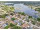 Aerial perspective showcases the property’s neighborhood setting with access to a nearby lake at 2486 Shiprock Ct, Deltona, FL 32738