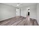 This versatile bedroom showcases sleek flooring, ceiling fan, and easy access to both bathroom and kitchen spaces at 2486 Shiprock Ct, Deltona, FL 32738