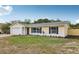 Charming one-story home featuring a well-manicured lawn and an attached garage at 2486 Shiprock Ct, Deltona, FL 32738