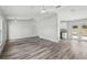 Spacious living room featuring wood-look flooring, a ceiling fan, and neutral paint at 2486 Shiprock Ct, Deltona, FL 32738