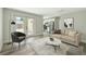 This stylish living room showcases backyard access, seamlessly connected to the kitchen and a comfortable seating area at 2486 Shiprock Ct, Deltona, FL 32738