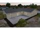An aerial dusk view of a home's freshly installed patio and new landscaping at 2486 Shiprock Ct, Deltona, FL 32738