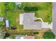 Overhead aerial view of the home, backyard and surrounding neighborhood at 2526 Chester Ave, New Smyrna Beach, FL 32168
