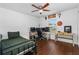 Bedroom featuring a ceiling fan, desk, and natural light at 2526 Chester Ave, New Smyrna Beach, FL 32168
