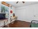 Bright bedroom features a ceiling fan, a closet, and views of the outdoors at 2526 Chester Ave, New Smyrna Beach, FL 32168