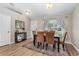 Dining room with hardwood floors and modern decor, featuring an inviting space for meals and entertaining at 2526 Chester Ave, New Smyrna Beach, FL 32168