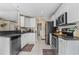 Modern kitchen features stainless steel appliances, granite countertops, and ample cabinet space at 2526 Chester Ave, New Smyrna Beach, FL 32168