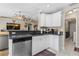 Bright and airy kitchen with stainless steel appliances and seamless access to the main living space at 2526 Chester Ave, New Smyrna Beach, FL 32168