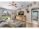 Comfortable living room with a large sectional, modern decor, and an open feel with backyard access at 2526 Chester Ave, New Smyrna Beach, FL 32168