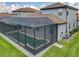 Aerial view of the home's screened-in pool and spa at 260 Teddy Rushing St, Debary, FL 32713