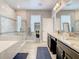 Modern bathroom featuring double vanity sinks, a soaking tub, and a separate shower with marble tile at 260 Teddy Rushing St, Debary, FL 32713