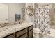 Bathroom with marble countertop and shower at 260 Teddy Rushing St, Debary, FL 32713