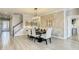 Dining area features a modern chandelier and a decorative stone accent wall for an elegant aesthetic at 260 Teddy Rushing St, Debary, FL 32713