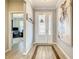 Well-lit entryway with an elegant front door, decorative accents, and a view into the office at 260 Teddy Rushing St, Debary, FL 32713