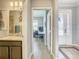 Hallway view showing half bath, office space, and front door entry at 260 Teddy Rushing St, Debary, FL 32713