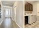 Hallway leading to the laundry room and front door at 260 Teddy Rushing St, Debary, FL 32713