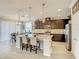 Kitchen with granite countertops, stainless steel appliances and an island with barstool seating at 260 Teddy Rushing St, Debary, FL 32713