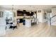 Open-concept kitchen with dark wood cabinets, stainless steel appliances, granite countertops, and a center island at 260 Teddy Rushing St, Debary, FL 32713