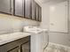 Laundry room featuring washer and dryer, utility sink, and storage at 260 Teddy Rushing St, Debary, FL 32713