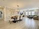Open living space featuring the dining and living room with natural light and neutral tones at 260 Teddy Rushing St, Debary, FL 32713