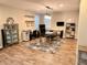 Spacious office with a work area, display shelves, and a modern area rug on wood floors at 260 Teddy Rushing St, Debary, FL 32713