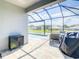 Screened-in pool area featuring stylish outdoor furniture and a view of the backyard at 260 Teddy Rushing St, Debary, FL 32713