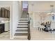 Staircase next to laundry room leading to dining area and offering a view of the second floor at 260 Teddy Rushing St, Debary, FL 32713