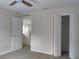 This bedroom boasts neutral walls, bi-fold closet doors, and a ceiling fan for added comfort at 2709 Sedgefield Ave, Deltona, FL 32725