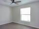 Bright bedroom with a ceiling fan and a window at 2709 Sedgefield Ave, Deltona, FL 32725