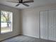Bedroom with carpet flooring, window, and closet at 2709 Sedgefield Ave, Deltona, FL 32725