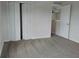 Bedroom features closet, neutral walls, carpeting, and an open door to another room at 2709 Sedgefield Ave, Deltona, FL 32725