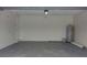 Spacious garage with epoxy flooring and water heater at 2709 Sedgefield Ave, Deltona, FL 32725
