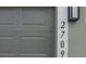 Close up of garage door and house numbers at 2709 Sedgefield Ave, Deltona, FL 32725