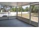 Relaxing screened lanai with view of backyard, offers a space for outdoor enjoyment at 2709 Sedgefield Ave, Deltona, FL 32725