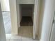 Storage under the stairs with carpet and tile flooring at 2709 Sedgefield Ave, Deltona, FL 32725