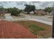 Residential street view from a window showing neighborhood homes at 2709 Sedgefield Ave, Deltona, FL 32725