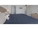 This main bedroom has light gray floors and white walls at 2711 N Halifax Ave # 496, Daytona Beach, FL 32118