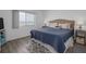 This main bedroom has a beautiful water view, light gray flooring, and white walls at 2711 N Halifax Ave # 496, Daytona Beach, FL 32118