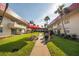 Exterior courtyard with grills and picnic tables surrounded by lush green grass at 2711 N Halifax Ave # 496, Daytona Beach, FL 32118