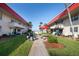 Exterior courtyard with grills and picnic tables surrounded by lush green grass at 2711 N Halifax Ave # 496, Daytona Beach, FL 32118