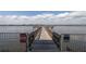 Private dock extending into the water, perfect for fishing, boating, and enjoying waterfront living at 2711 N Halifax Ave # 496, Daytona Beach, FL 32118