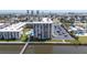 Exterior shot of the condo building with a water view, pool, and parking area at 2711 N Halifax Ave # 496, Daytona Beach, FL 32118