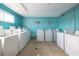 Large laundry room with rows of coin-operated washers at 2711 N Halifax Ave # 496, Daytona Beach, FL 32118