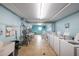 Laundry room featuring multiple washing machines, dryers, and utility sink at 2711 N Halifax Ave # 496, Daytona Beach, FL 32118