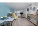 The open-concept living area with a dining table, a comfortable seating arrangement and water views at 2711 N Halifax Ave # 496, Daytona Beach, FL 32118