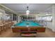 Recreation room features a pool table, seating, and entertainment options for residents to enjoy at 2711 N Halifax Ave # 496, Daytona Beach, FL 32118